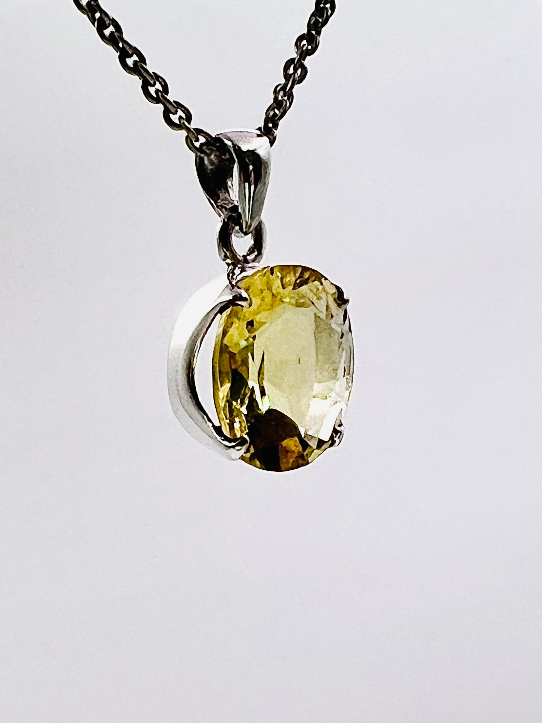 Facetted South Indian ( Karur) Yellow Scapolite with Natural Oil Base Biotite Inclusions in .925 Silver Setting