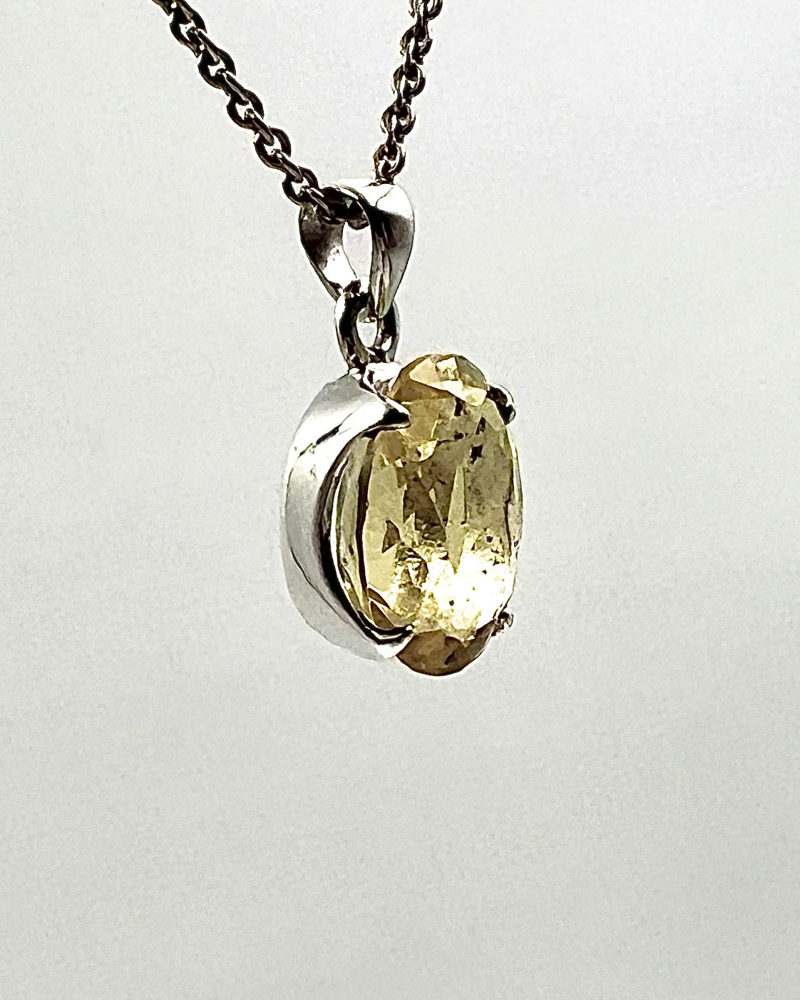 Facetted South Indian ( Karur) Yellow Scapolite with Natural Oil Base Biotite Inclusions in .925 Silver Setting
