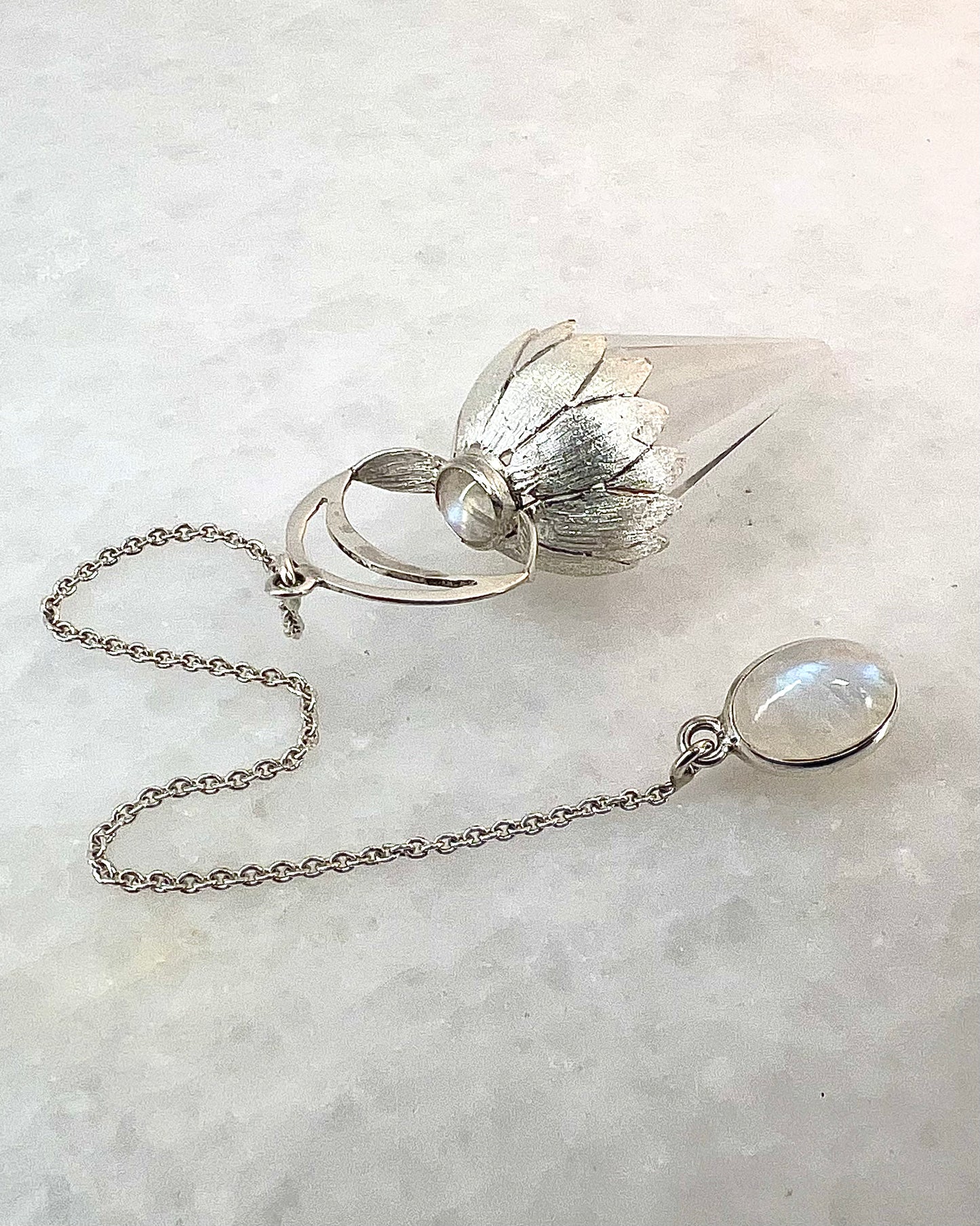 Vogel Cut Crystal Point w/ Rainbow Moonstone in Fancy .925 Silver Setting with Engraved Flower Leaves Design as a Pendulum