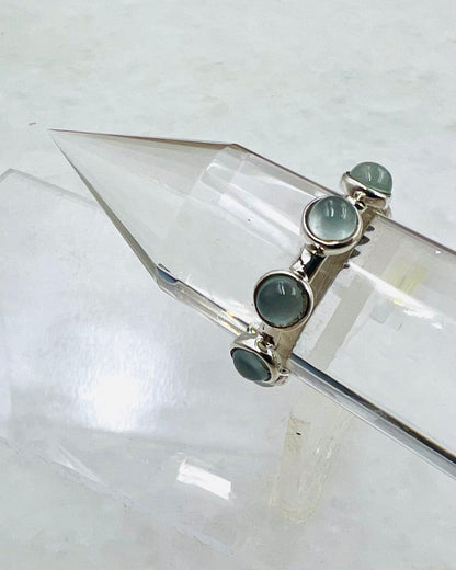 Baguette en cristal Vogel aigue-marine sertie de 3 sphères de lotus ouvertes