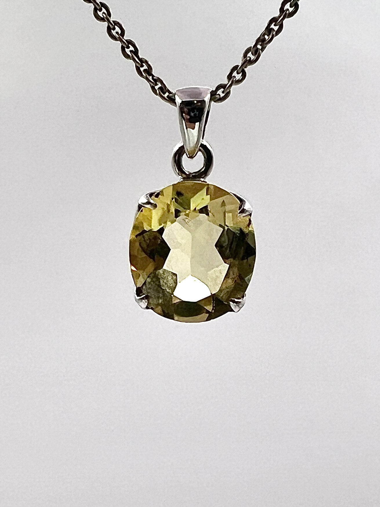 Facetted South Indian ( Karur) Yellow Scapolite  with Natural Oil Base Biotite Inclusions in .925 Silver Setting