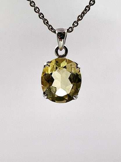 Facetted South Indian ( Karur) Yellow Scapolite  with Natural Oil Base Biotite Inclusions in .925 Silver Setting