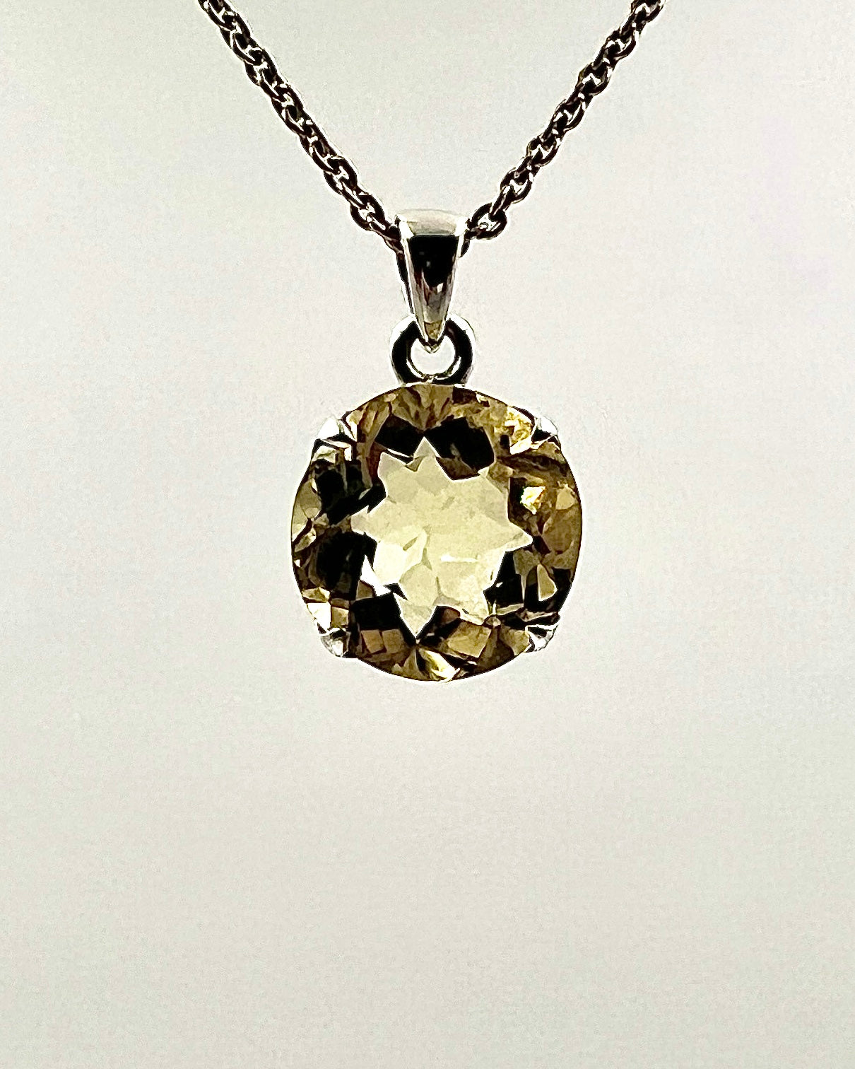 Facetted South Indian ( Karur) Yellow Scapolite  with Natural Oil Base Biotite Inclusions in .925 Silver Setting