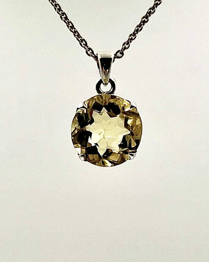Facetted South Indian ( Karur) Yellow Scapolite  with Natural Oil Base Biotite Inclusions in .925 Silver Setting