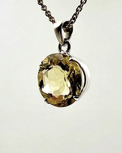 Facetted South Indian ( Karur) Yellow Scapolite  with Natural Oil Base Biotite Inclusions in .925 Silver Setting