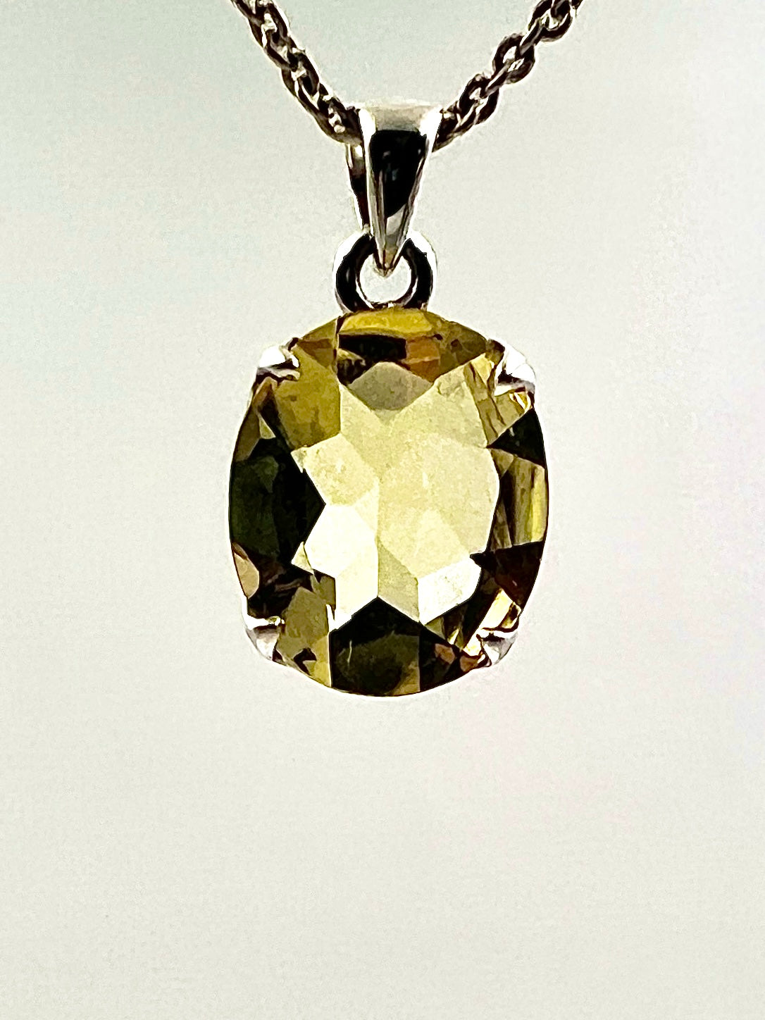 Facetted South Indian ( Karur) Yellow Scapolite  with Natural Oil Base Biotite Inclusions in .925 Silver Setting