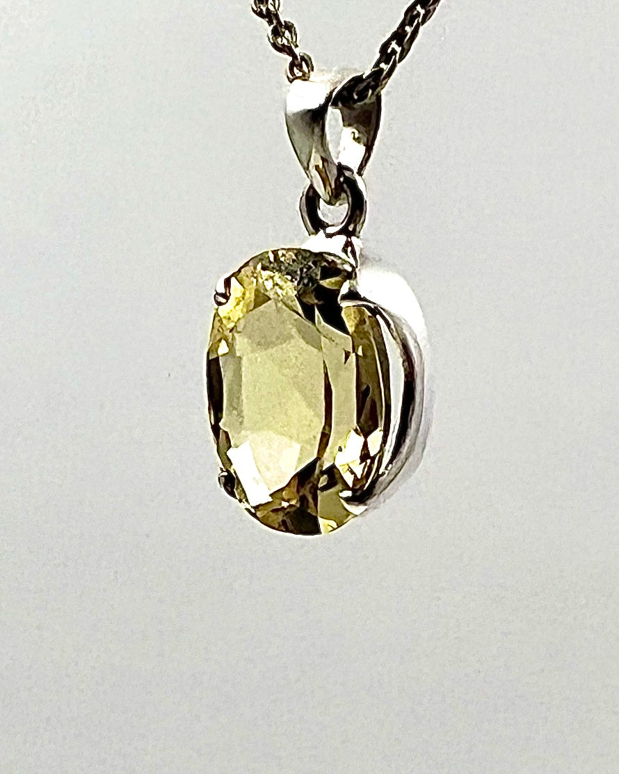 Facetted South Indian ( Karur) Yellow Scapolite  with Natural Oil Base Biotite Inclusions in .925 Silver Setting