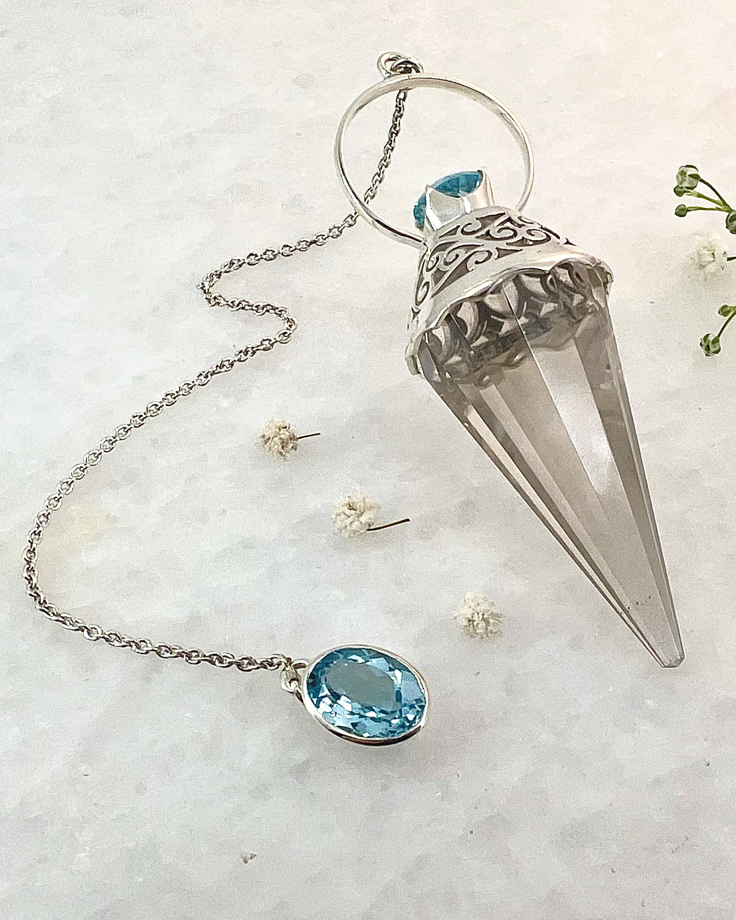 Vogel Cut Crystal Point with Facetted Blue Topazes in Fancy .925 Silver Setting with Cutwork Design as a Pendulum