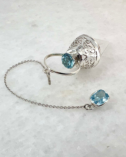 Vogel Cut Crystal Point with Facetted Blue Topazes in Fancy .925 Silver Setting with Cutwork Design as a Pendulum