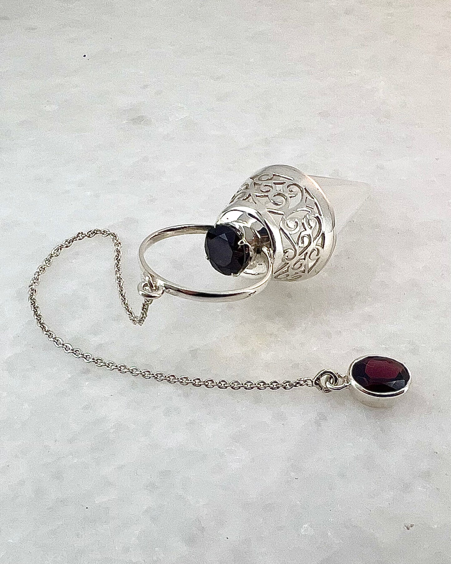 Vogel Cut Crystal Point with Facetted Garnets in Fancy .925 Silver Setting with Cutwork Design as a Pendulum
