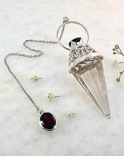 Vogel Cut Crystal Point with Facetted Garnets in Fancy .925 Silver Setting with Cutwork Design as a Pendulum