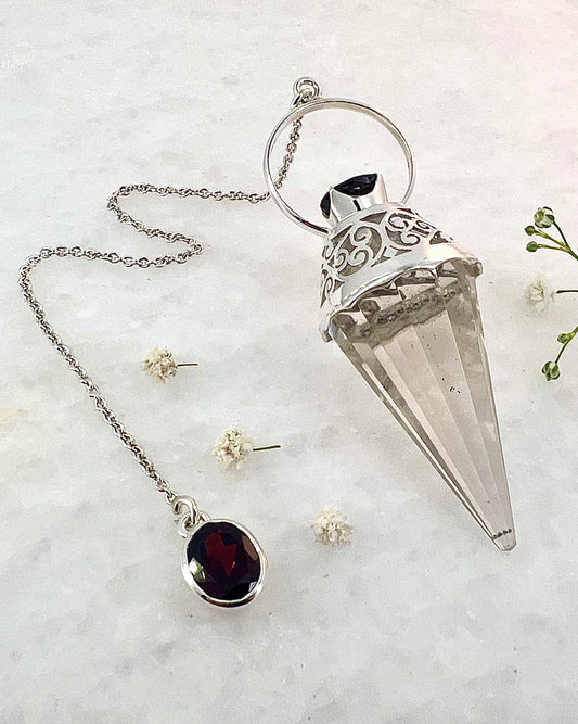 Vogel Cut Crystal Point with Facetted Garnets in Fancy .925 Silver Setting with Cutwork Design as a Pendulum