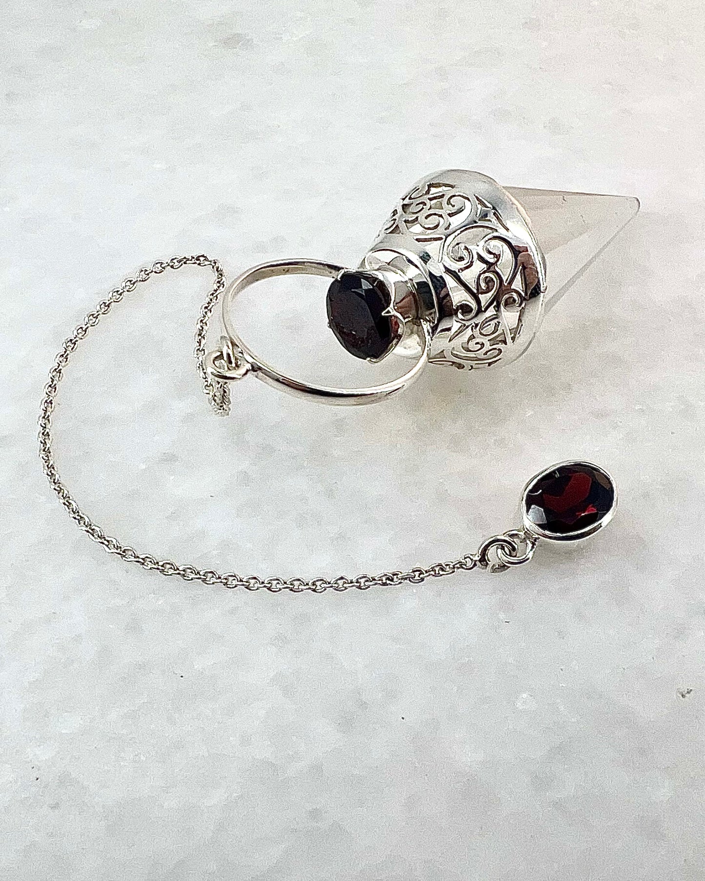 Vogel Cut Crystal Point with Facetted Garnets in Fancy .925 Silver Setting with Cutwork Design as a Pendulum