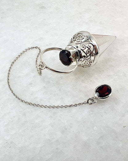 Vogel Cut Crystal Point with Facetted Garnets in Fancy .925 Silver Setting with Cutwork Design as a Pendulum