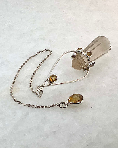 Vogel Cut Double Terminated Crystal Point with 7 Facetted Citrines in .925 Silver Setting  as a Pendulum