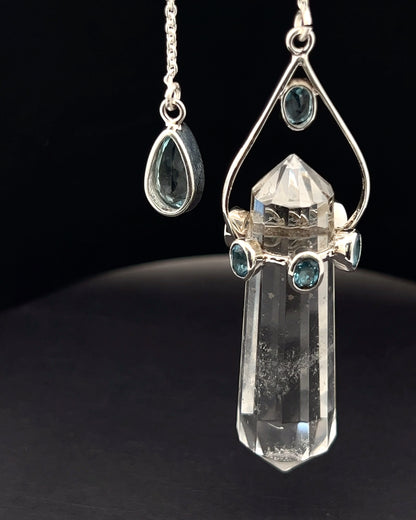 Vogel Cut Double Terminated Crystal Point w/ 8 Facetted Blue Topaz in .925 Silver Setting  as a Pendulum