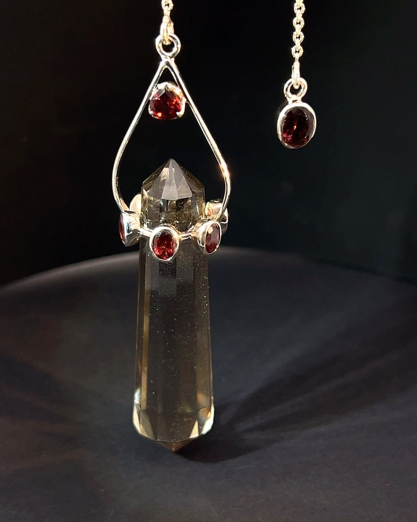 Vogel Cut Double Terminated Smoky Crystal Point w/ 8 Facetted Garnets in .925 Silver Setting  as a Pendulum