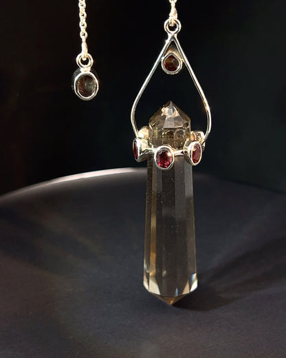 Vogel Cut Double Terminated Smoky Crystal Point w/ 8 Facetted Garnets in .925 Silver Setting  as a Pendulum