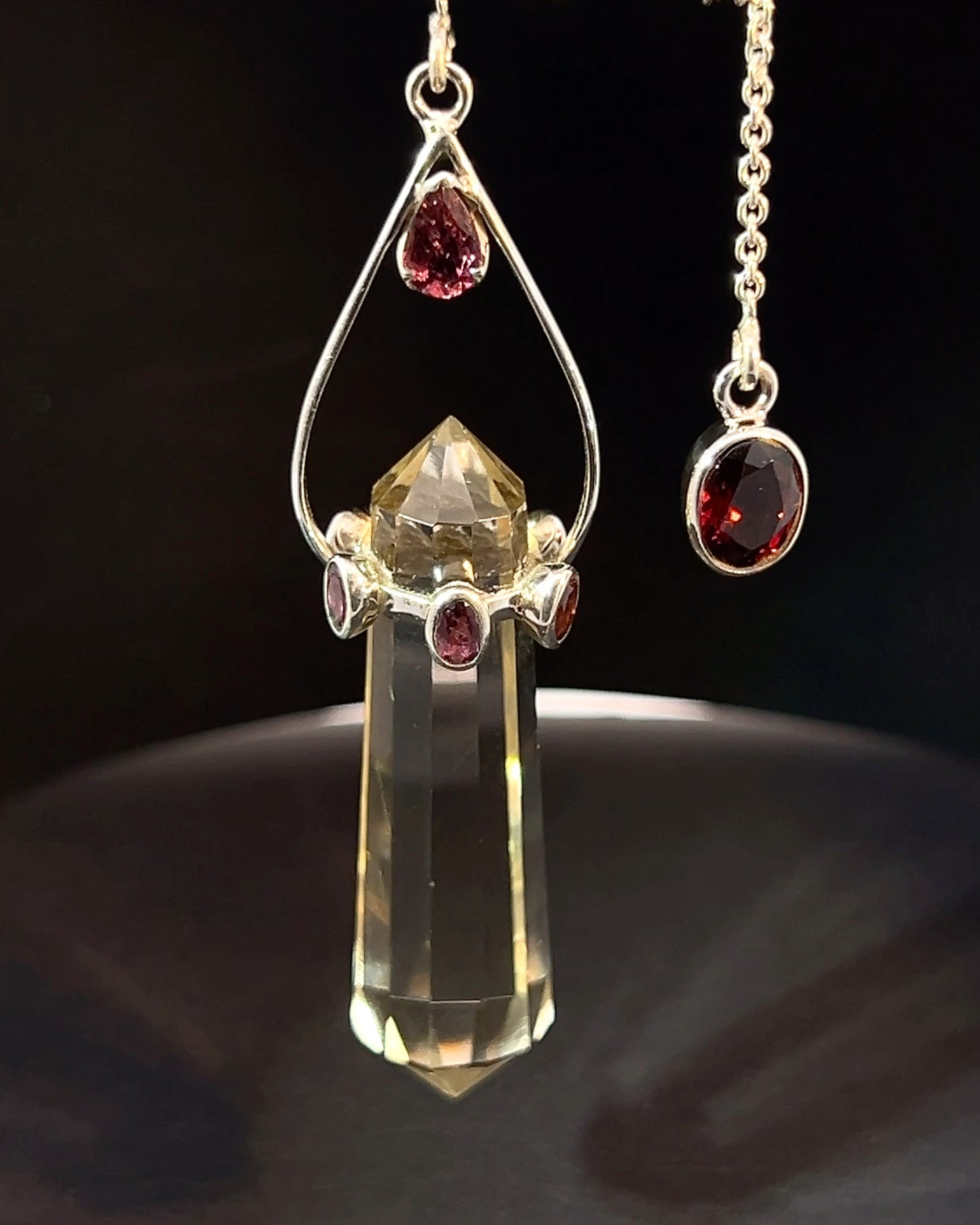 Vogel Cut Double Terminated Crystal Point with 7 Facetted Red Turmalines in .925 Silver Setting  as a Pendulum