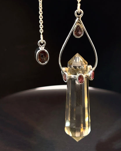 Vogel Cut Double Terminated Crystal Point with 7 Facetted Red Turmalines in .925 Silver Setting  as a Pendulum