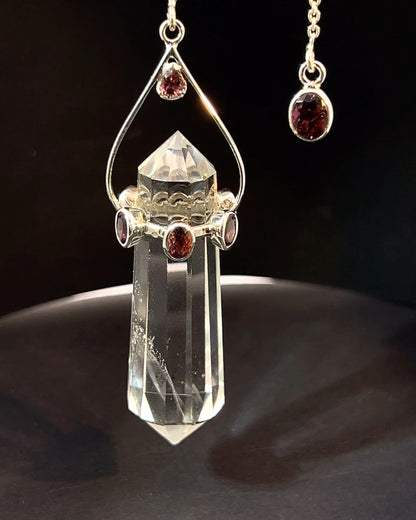 Vogel Cut Double Terminated Crystal Point with 7 Facetted  Red Turmalines in .925 Silver Setting  as a Pendulum