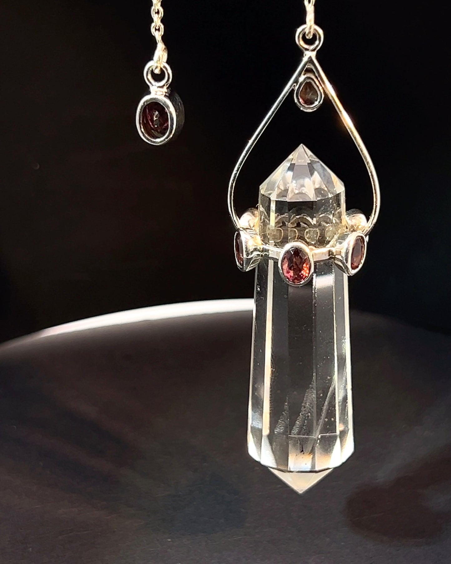 Vogel Cut Double Terminated Crystal Point with 7 Facetted  Red Turmalines in .925 Silver Setting  as a Pendulum