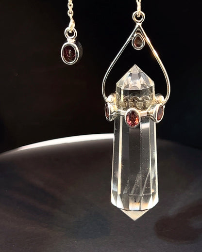 Vogel Cut Double Terminated Crystal Point with 7 Facetted  Red Turmalines in .925 Silver Setting  as a Pendulum