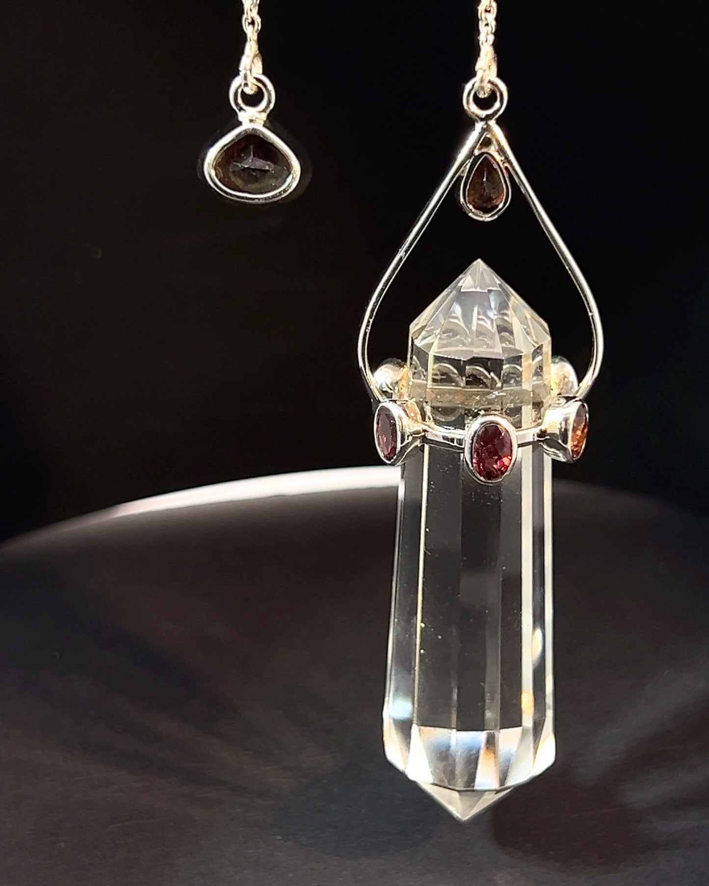 Vogel Cut Double Terminated Crystal Point with 7 Facetted  Red Turmalines in .925 Silver Setting  as a Pendulum