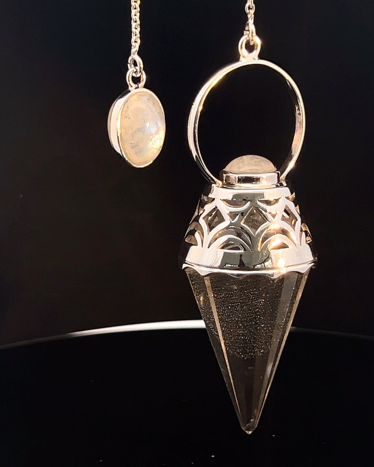 Vogel Cut Crystal Point w/ Rainbow Moonstone Cabachons in Fancy .925 Silver Setting w/ Cutwork Design as a Pendulum