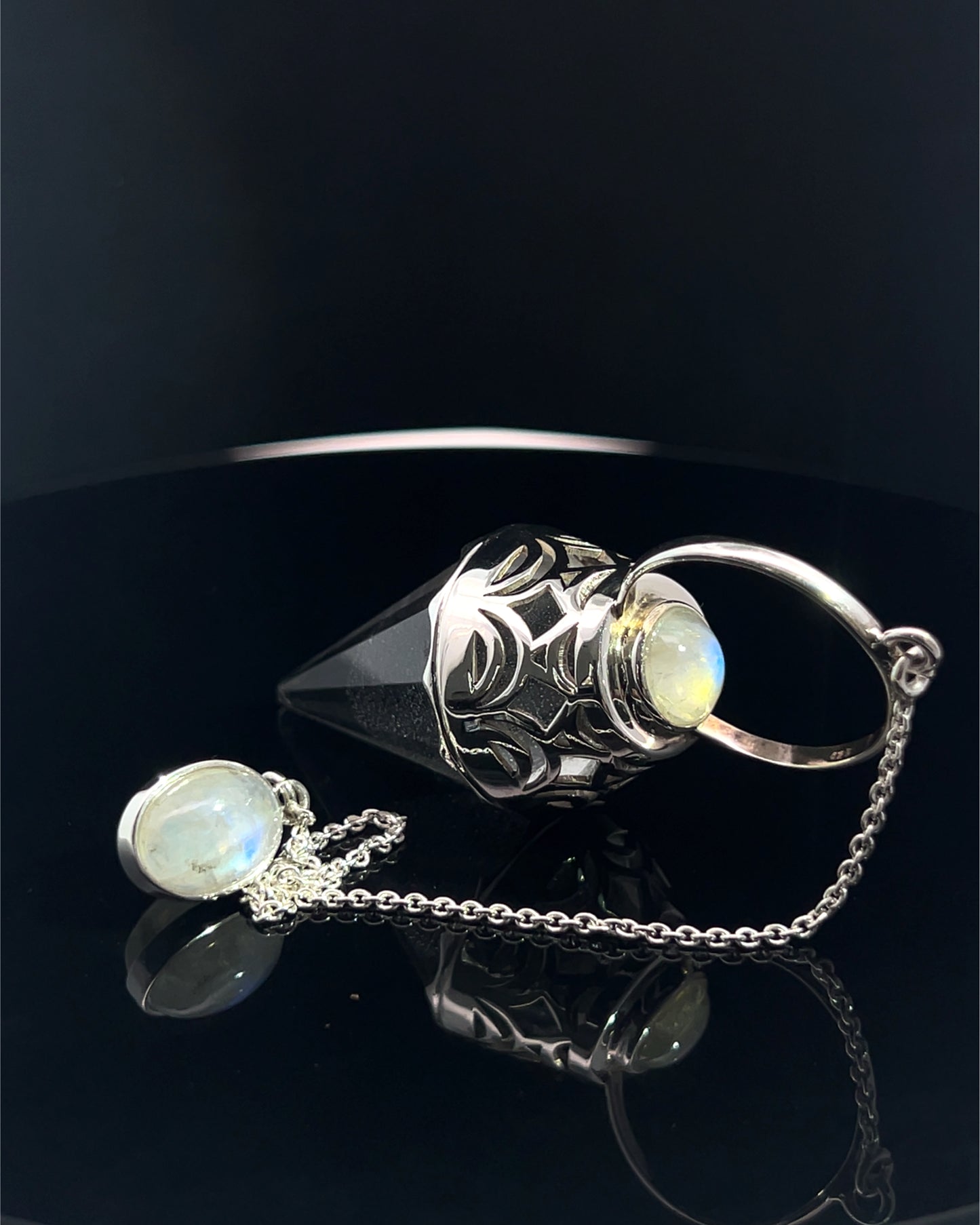 Vogel Cut Crystal Point w/ Rainbow Moonstone Cabachons in Fancy .925 Silver Setting w/ Cutwork Design as a Pendulum