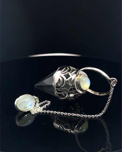 Vogel Cut Crystal Point w/ Rainbow Moonstone Cabachons in Fancy .925 Silver Setting w/ Cutwork Design as a Pendulum