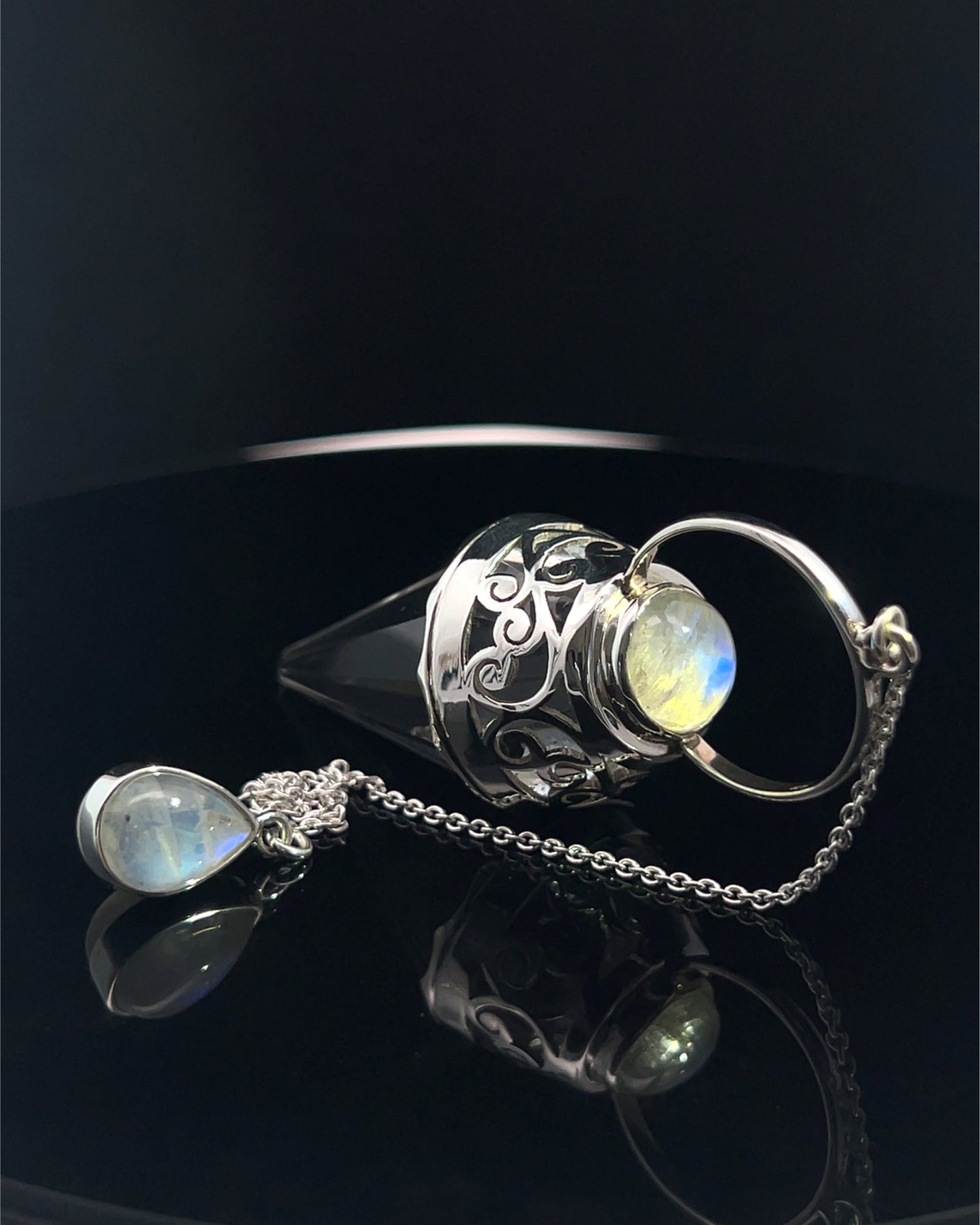 Vogel Cut Crystal Point w/ Rainbow Moonstone Cabochons in Fancy .925 Silver Setting w/ Cutwork Design as a Pendulum