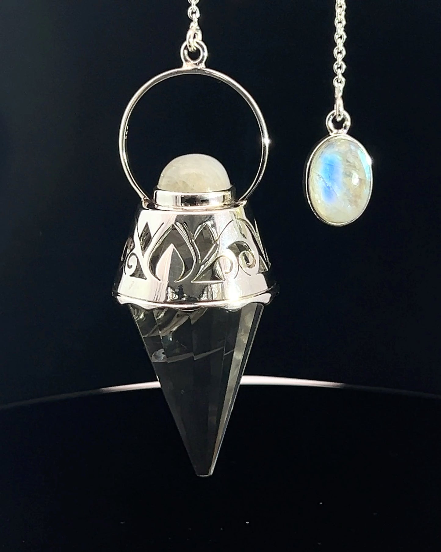 Vogel Cut Crystal Point w/ Rainbow Moonstone Cabachons in Fancy .925 Silver Setting w/ Cutwork Design as a Pendulum