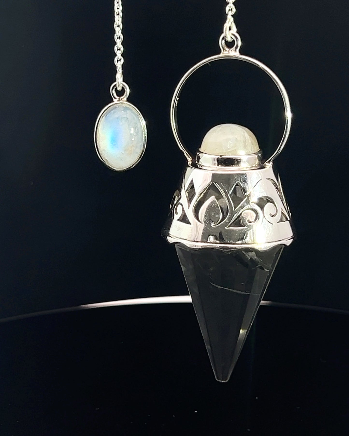 Vogel Cut Crystal Point w/ Rainbow Moonstone Cabachons in Fancy .925 Silver Setting w/ Cutwork Design as a Pendulum