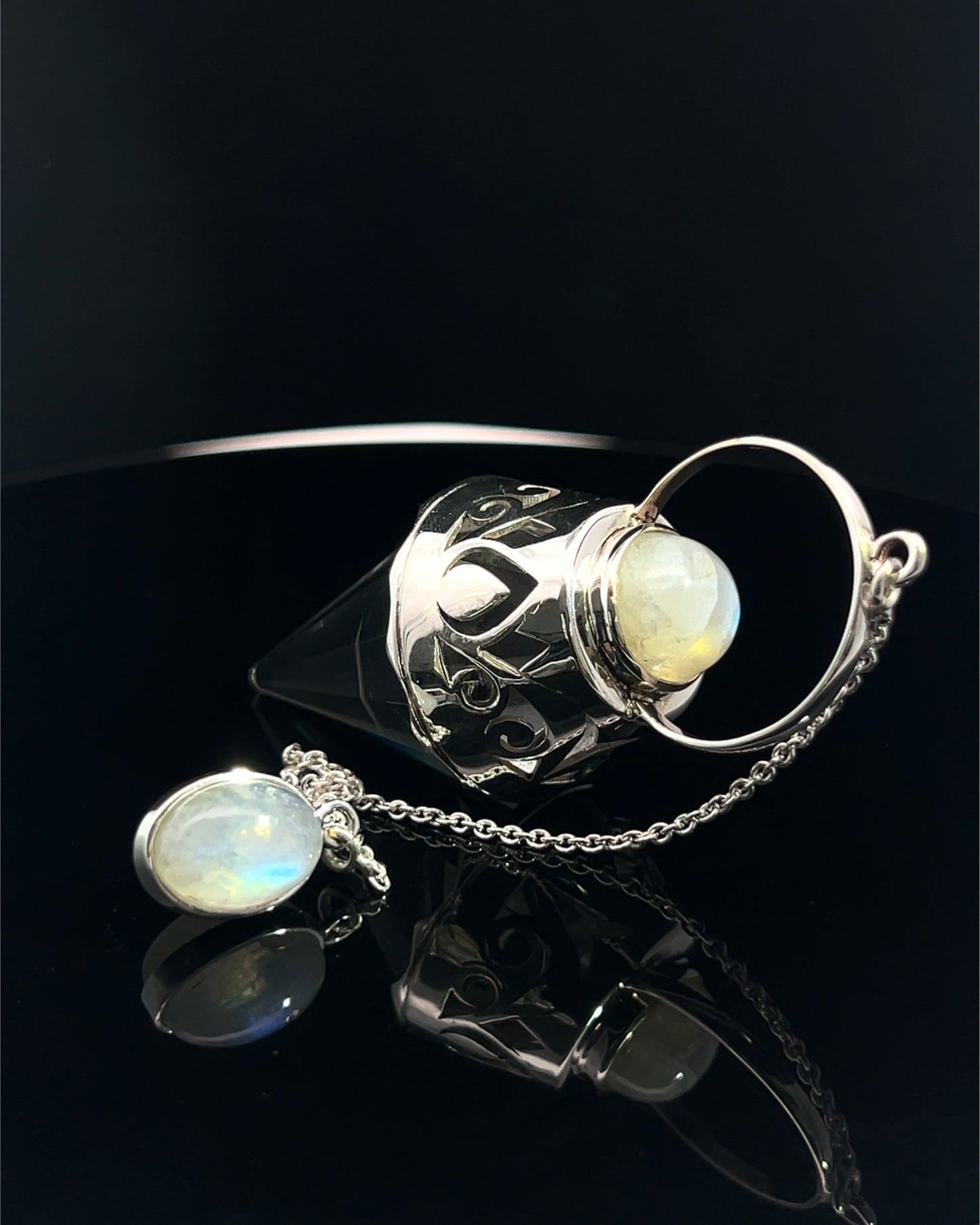 Vogel Cut Crystal Point w/ Rainbow Moonstone Cabachons in Fancy .925 Silver Setting w/ Cutwork Design as a Pendulum