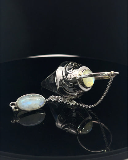 Vogel Cut Crystal Point w/ Rainbow Moonstone Cabachons in Fancy .925 Silver Setting w/ Cutwork Design as a Pendulum