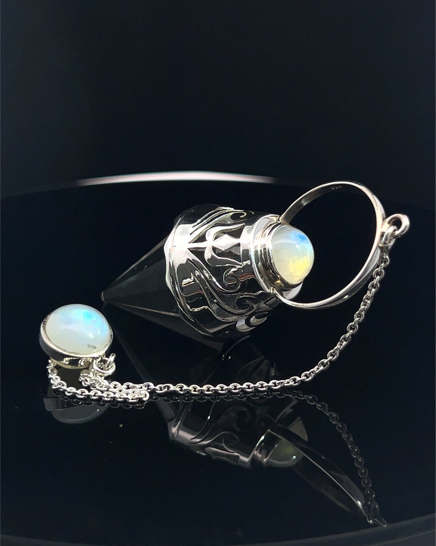 Vogel Cut Crystal Point w/ Rainbow Moonstone Cabachons in Fancy .925 Silver Setting w/ Cutwork Design as a Pendulum