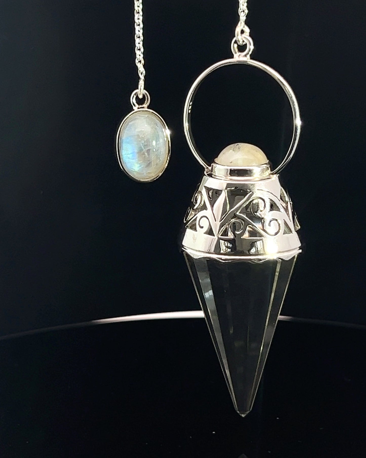 Vogel Cut Crystal Point w/ Rainbow Moonstone Cabachons in Fancy .925 Silver Setting w/ Cutwork Design as a Pendulum