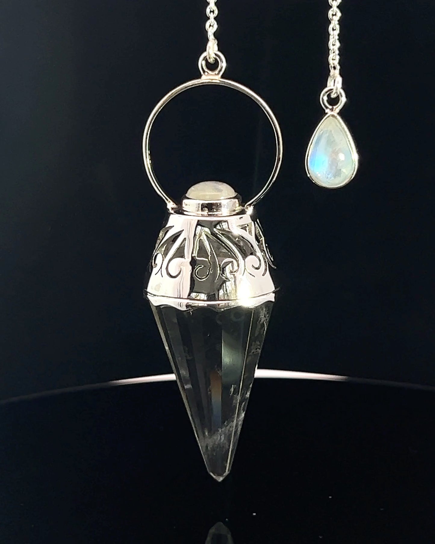 Vogel Cut Crystal Point w/ Rainbow Moonstone Cabachons in Fancy .925 Silver Setting w/ Cutwork Design as a Pendulum