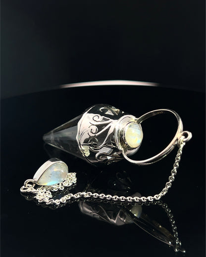 Vogel Cut Crystal Point w/ Rainbow Moonstone Cabachons in Fancy .925 Silver Setting w/ Cutwork Design as a Pendulum