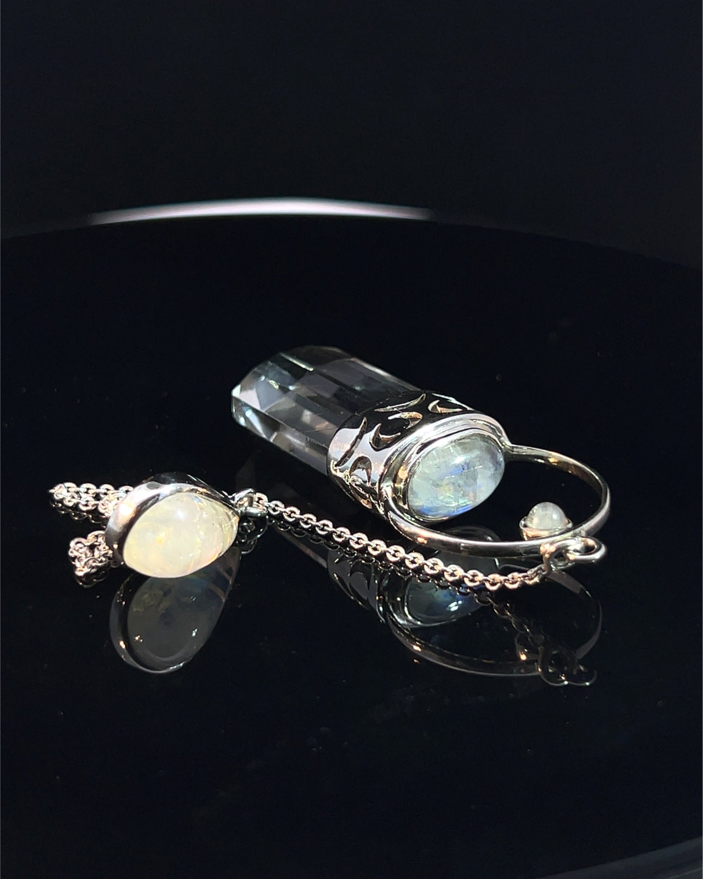 Straight 12 facet  Crystal Point w/ Rainbow Moonstone Cabachons Accents and Finger Loop in Fancy .925 Silver Setting w/ Moon Cutwork Design as a Pendulum