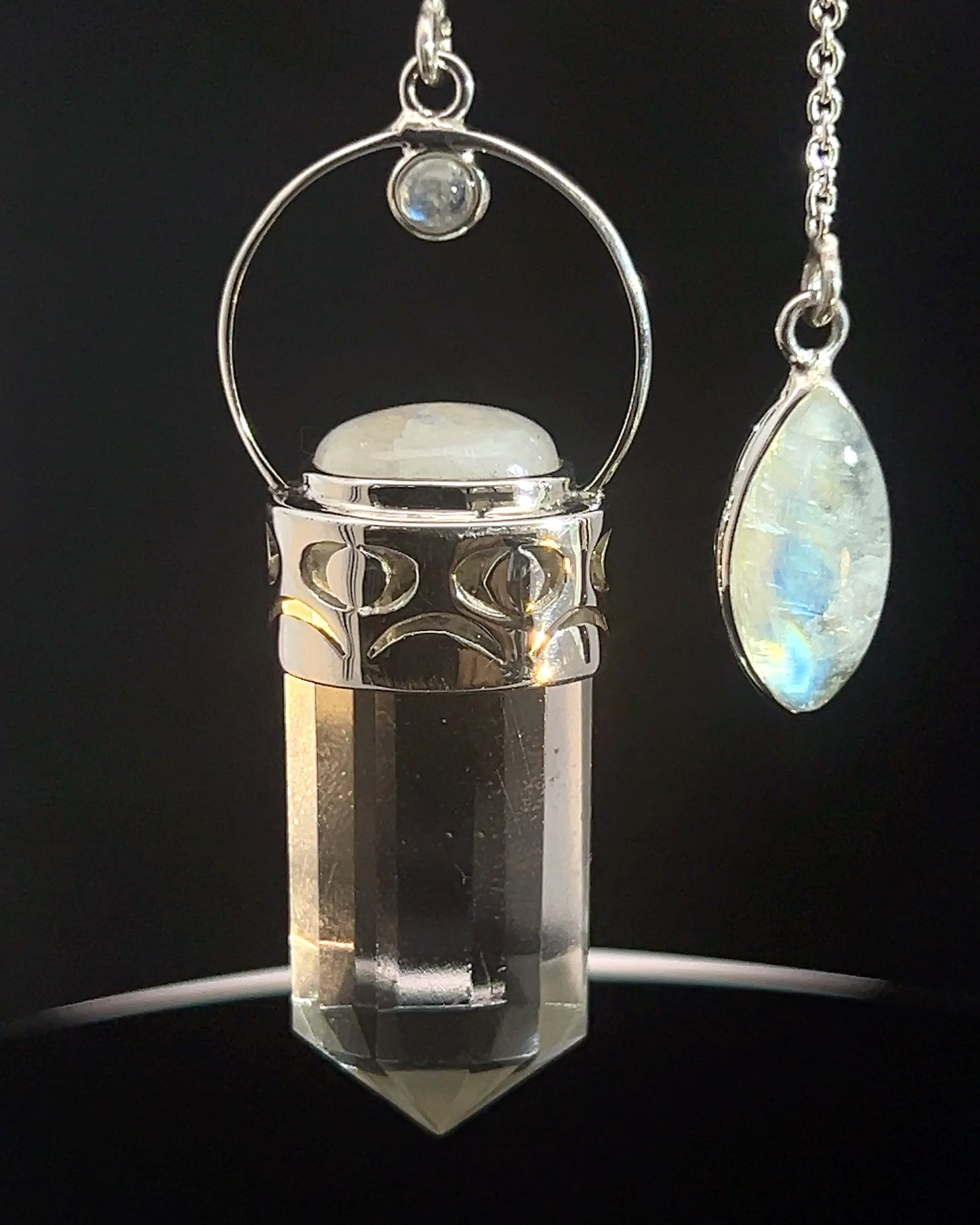 Straight 12 facet  Crystal Point w/ Rainbow Moonstone Cabachons Accents and Finger Loop in Fancy .925 Silver Setting w/ Moon Cutwork Design as a Pendulum
