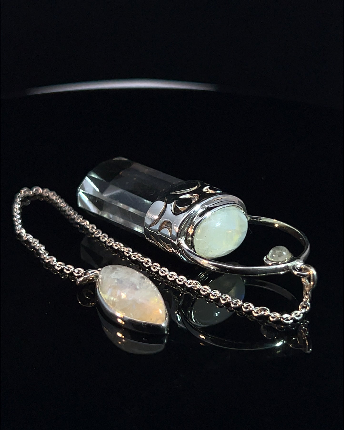 Straight 12 facet  Crystal Point w/ Rainbow Moonstone Cabachons Accents and Finger Loop in Fancy .925 Silver Setting w/ Moon Cutwork Design as a Pendulum