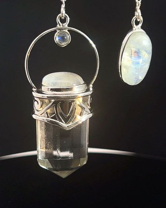 Straight 12 facet Crystal Point w/ Rainbow Moonstone Cabachons Accents and Finger Loop in Fancy .925 Silver Setting w/ Fancy Cutwork Design as a Pendulum