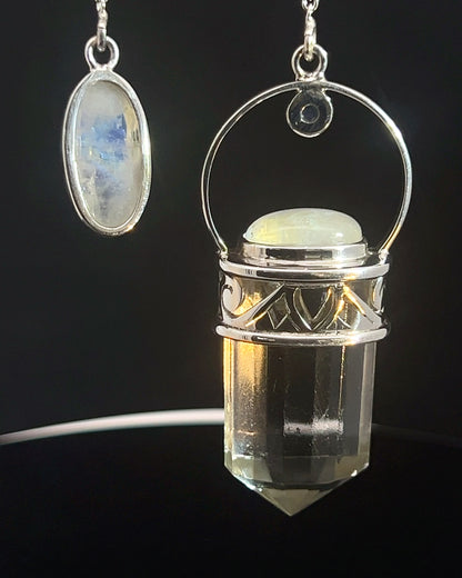 Straight 12 facet Crystal Point w/ Rainbow Moonstone Cabachons Accents and Finger Loop in Fancy .925 Silver Setting w/ Fancy Cutwork Design as a Pendulum