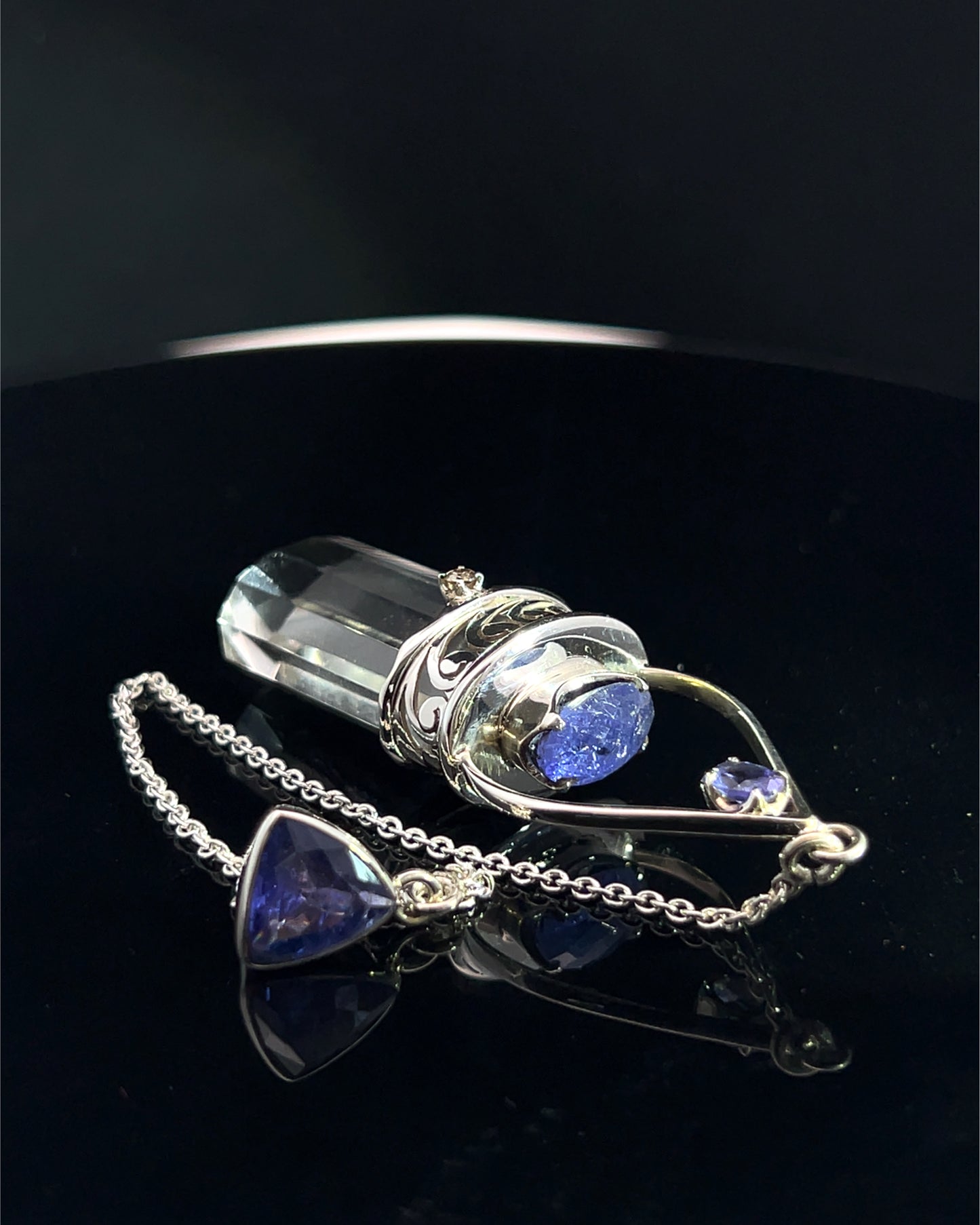 Straight 12 facet Crystal Point w/ Facetted Tanzanite  & Diamond Accents in .925 Silver Setting w/ Fancy Cutwork Design as a Pendulum