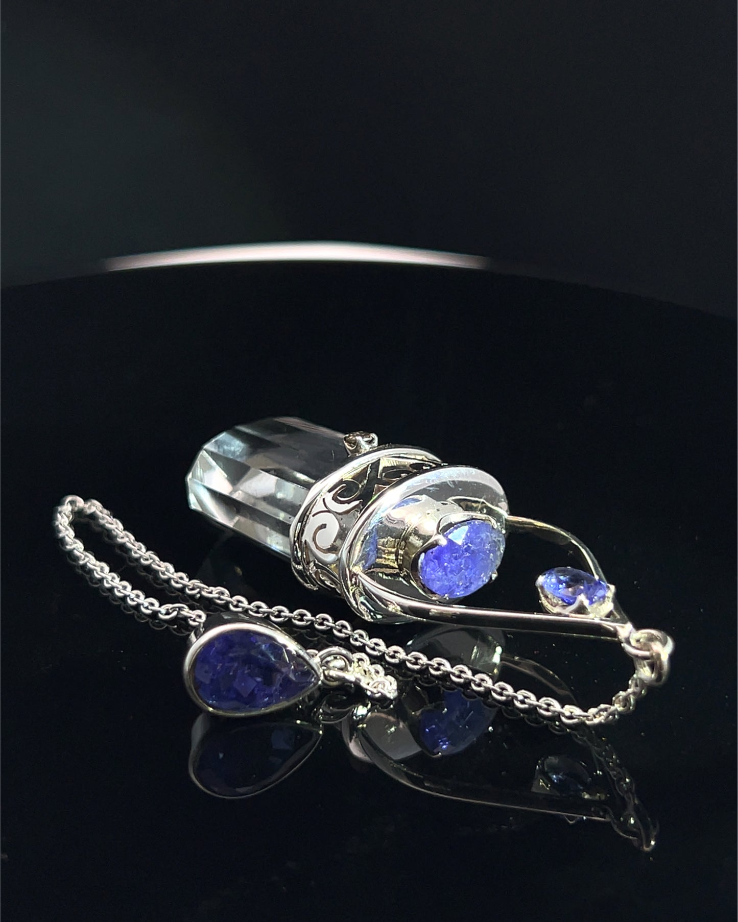 Straight 12 facet Crystal Point w/ Facetted Tanzanite  & Diamond Accents in .925 Silver Setting w/ Fancy Cutwork Design as a Pendulum
