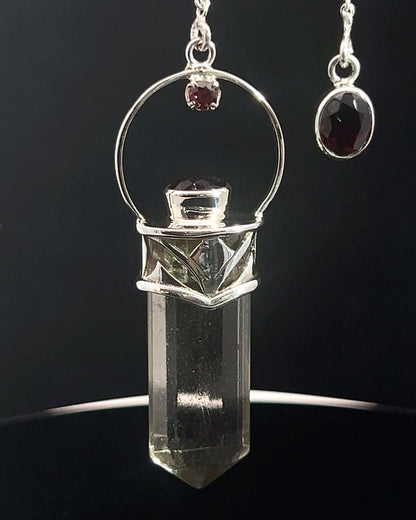 Straight 12 facet Crystal Point w/ Facetted Garnet Accents in .925 Silver Setting w/ Fancy Cutwork Design as a Pendulum