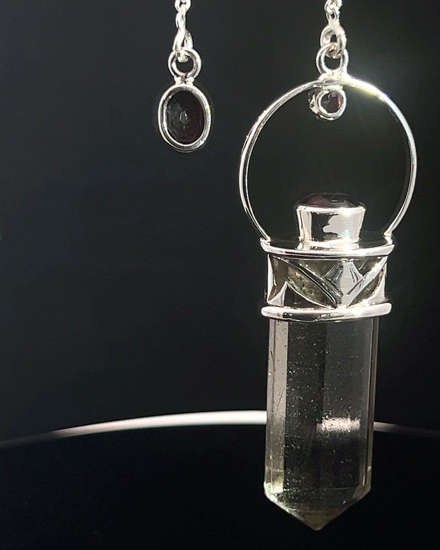 Straight 12 facet Crystal Point w/ Facetted Garnet Accents in .925 Silver Setting w/ Fancy Cutwork Design as a Pendulum