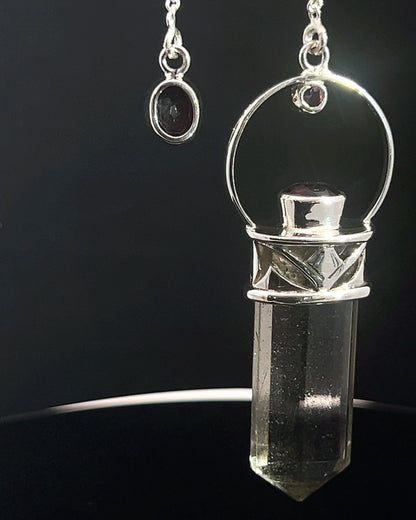 Straight 12 facet Crystal Point w/ Facetted Garnet Accents in .925 Silver Setting w/ Fancy Cutwork Design as a Pendulum
